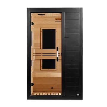 A modern single-door infrared sauna with a black exterior frame and tempered glass door, featuring light natural wood interior walls, benches, and ceiling.
